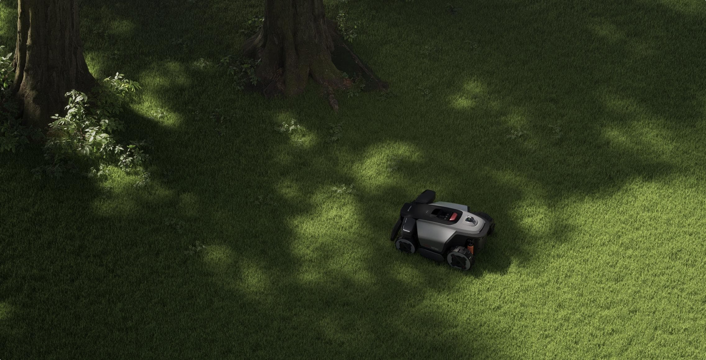 Roborock RockMow Z1 LiDAR med košnjo trate ob drevesih in gredicah